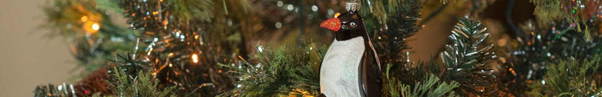 A penguin bauble on a Christmas tree