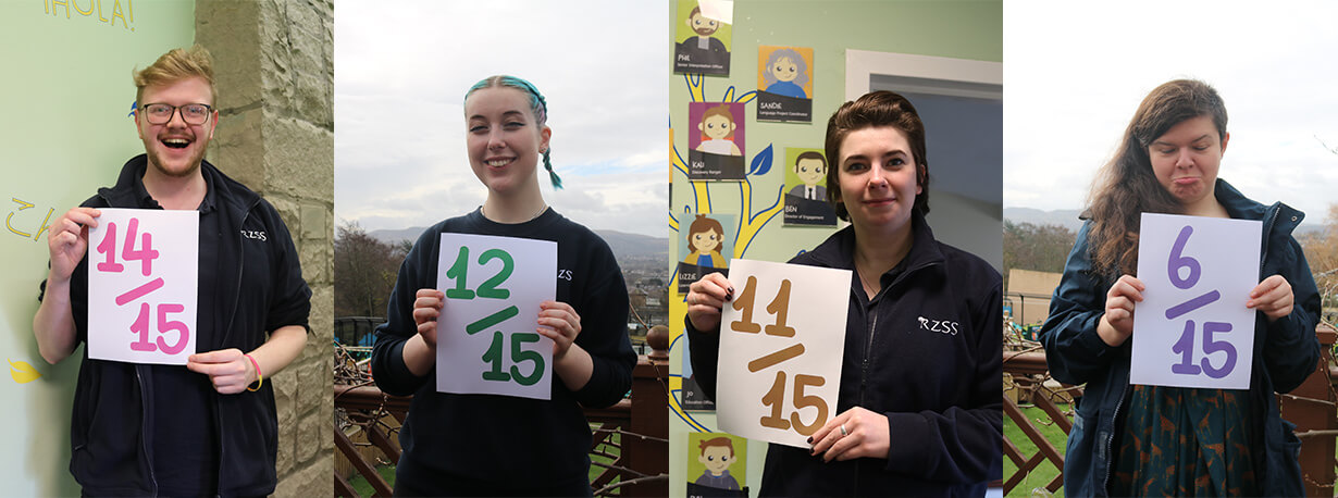 Discovery rangers holding up signs with their quiz scores