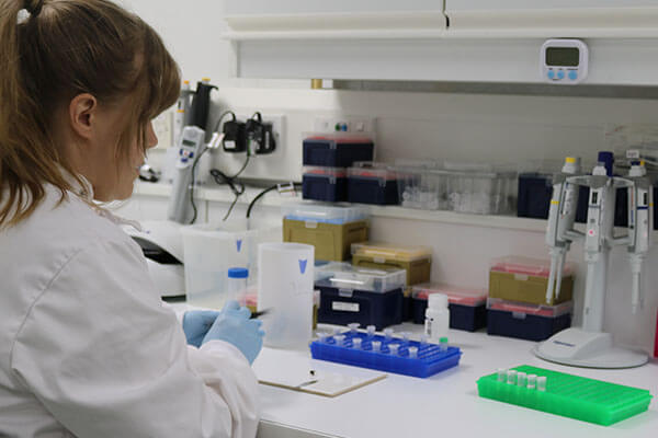 a researcher working in the WildGenes lab at Edinburgh Zoo